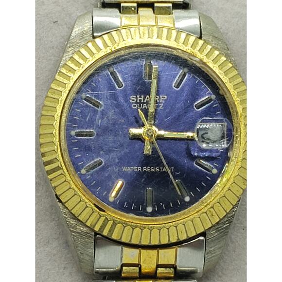 Sharp women\'s watch, 365384. dark blue iridescent face. Calendar on face